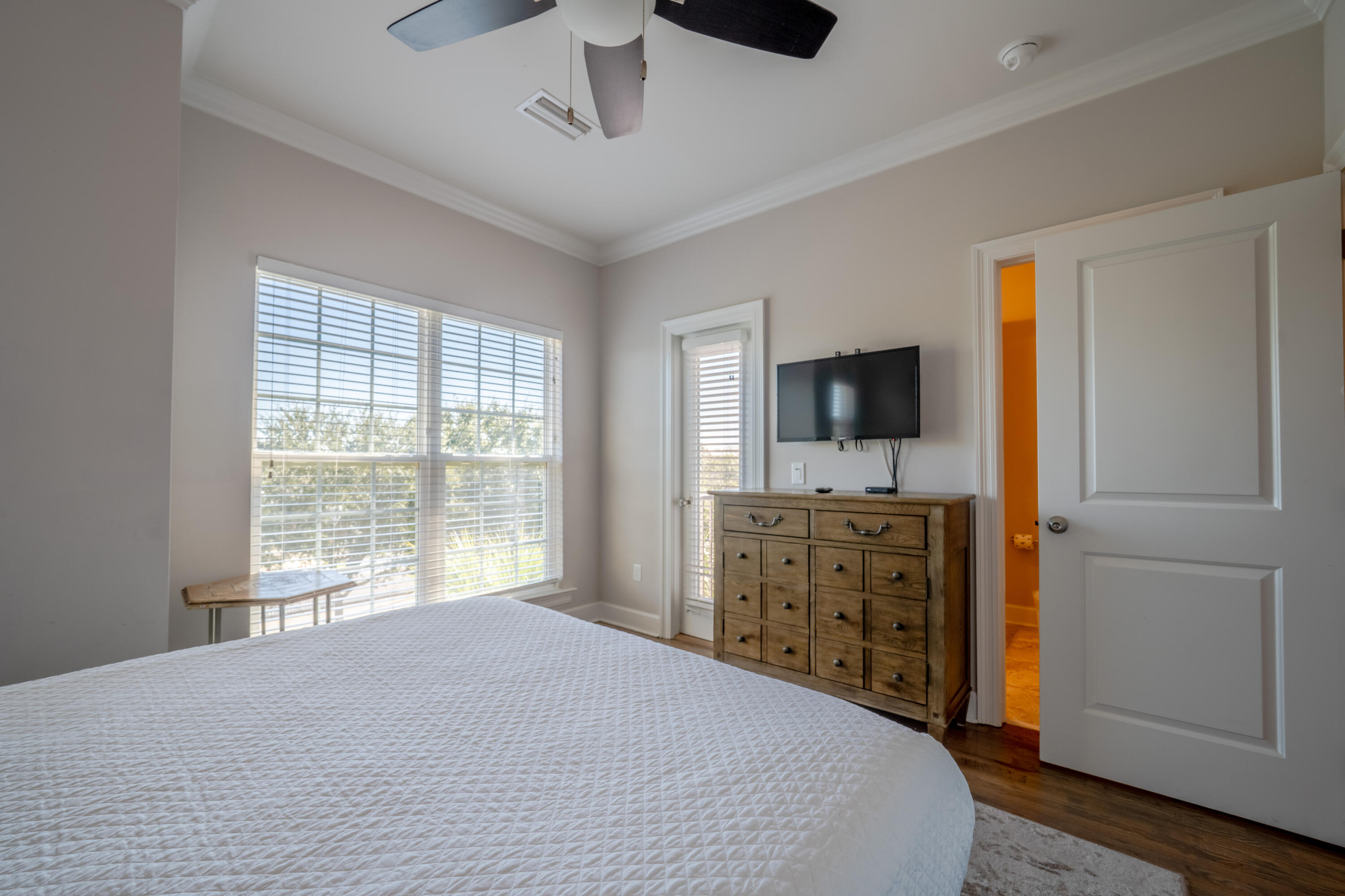 257 Driftwood Road, Unit 2 Miramar Beach, FL 32550 - Photo 32 of 35 a bedroom with a bed and a flat screen tv