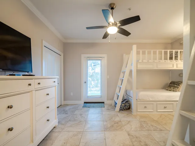 a view of an empty room with cabinet and flat screen tv