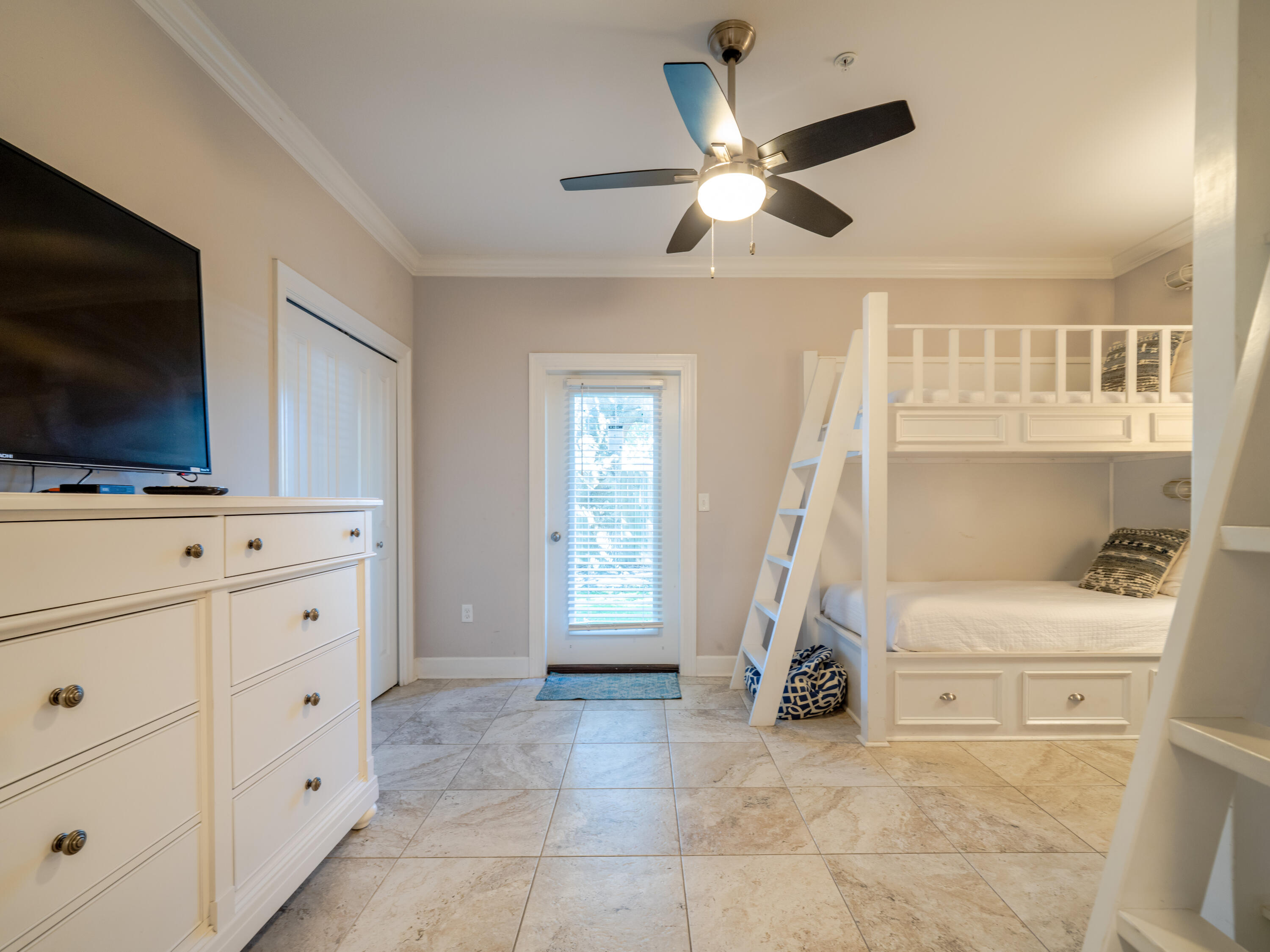 257 Driftwood Road, Unit 2 Miramar Beach, FL 32550 - Photo 5 of 35 a view of an empty room with cabinet and flat screen tv