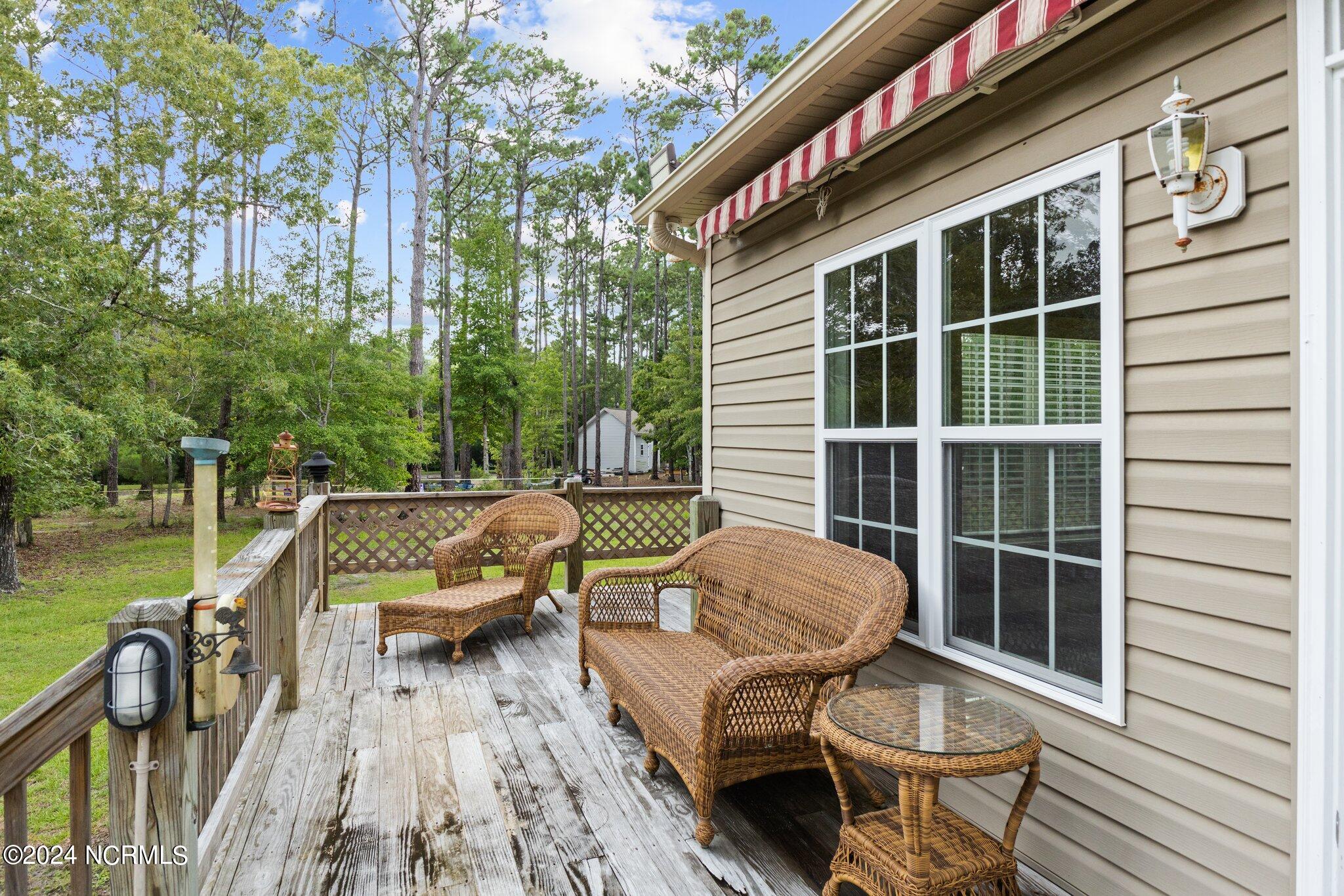 555 Eagle Road Newport, NC 28570 - Photo 38 of 57 BACK DECK WITH ROLL OUT AWNING