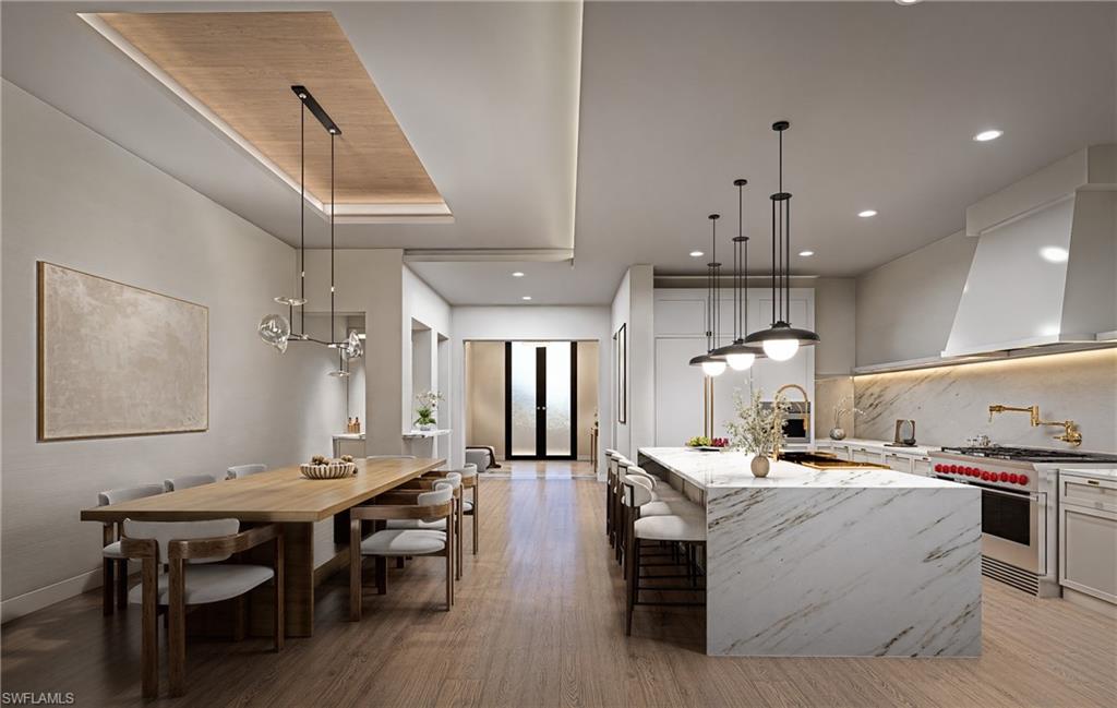 210 9th Street South, Unit 201 Naples, FL 34102 - Photo 3 of 6 a large kitchen with a table and chairs