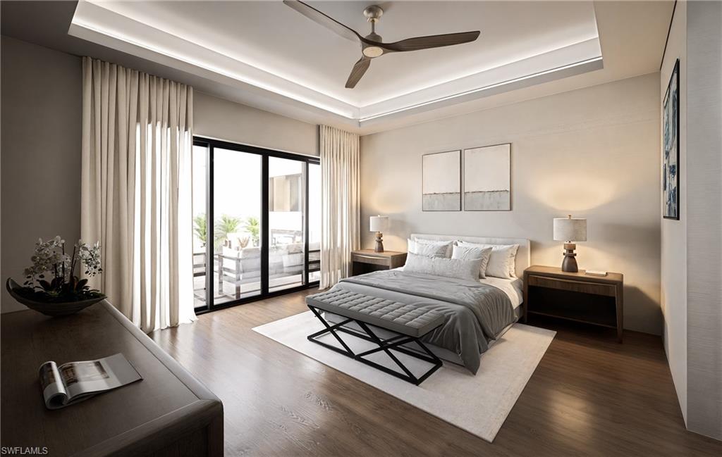 210 9th Street South, Unit 201 Naples, FL 34102 - Photo 4 of 6 a spacious bedroom with a bed and a couch