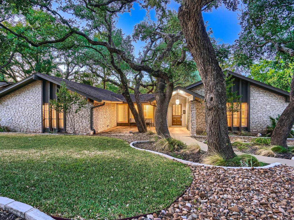 7306 Running Rope Austin, TX 78731 - Photo 1 of 1 a front view of a house with garden