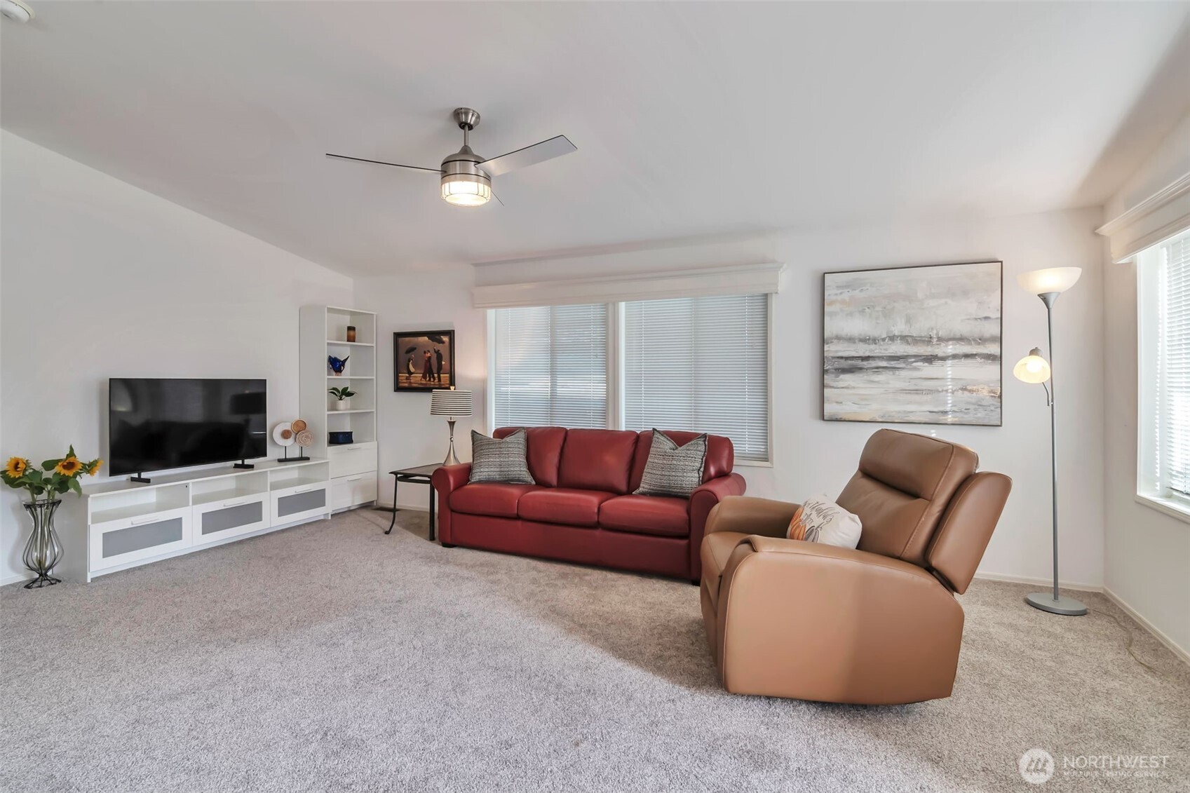 23708 Locust Way, Unit 65 Bothell, WA 98021 - Photo 11 of 32 a living room with furniture and a flat screen tv