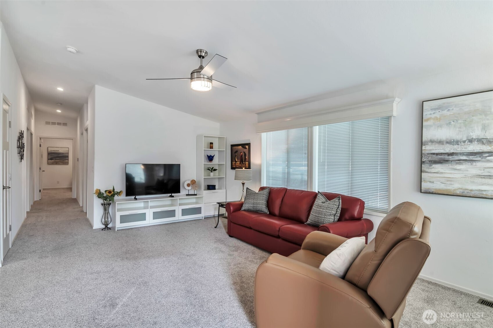 23708 Locust Way, Unit 65 Bothell, WA 98021 - Photo 12 of 32 a living room with furniture and a flat screen tv