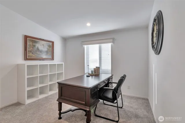 a workspace with furniture and a window