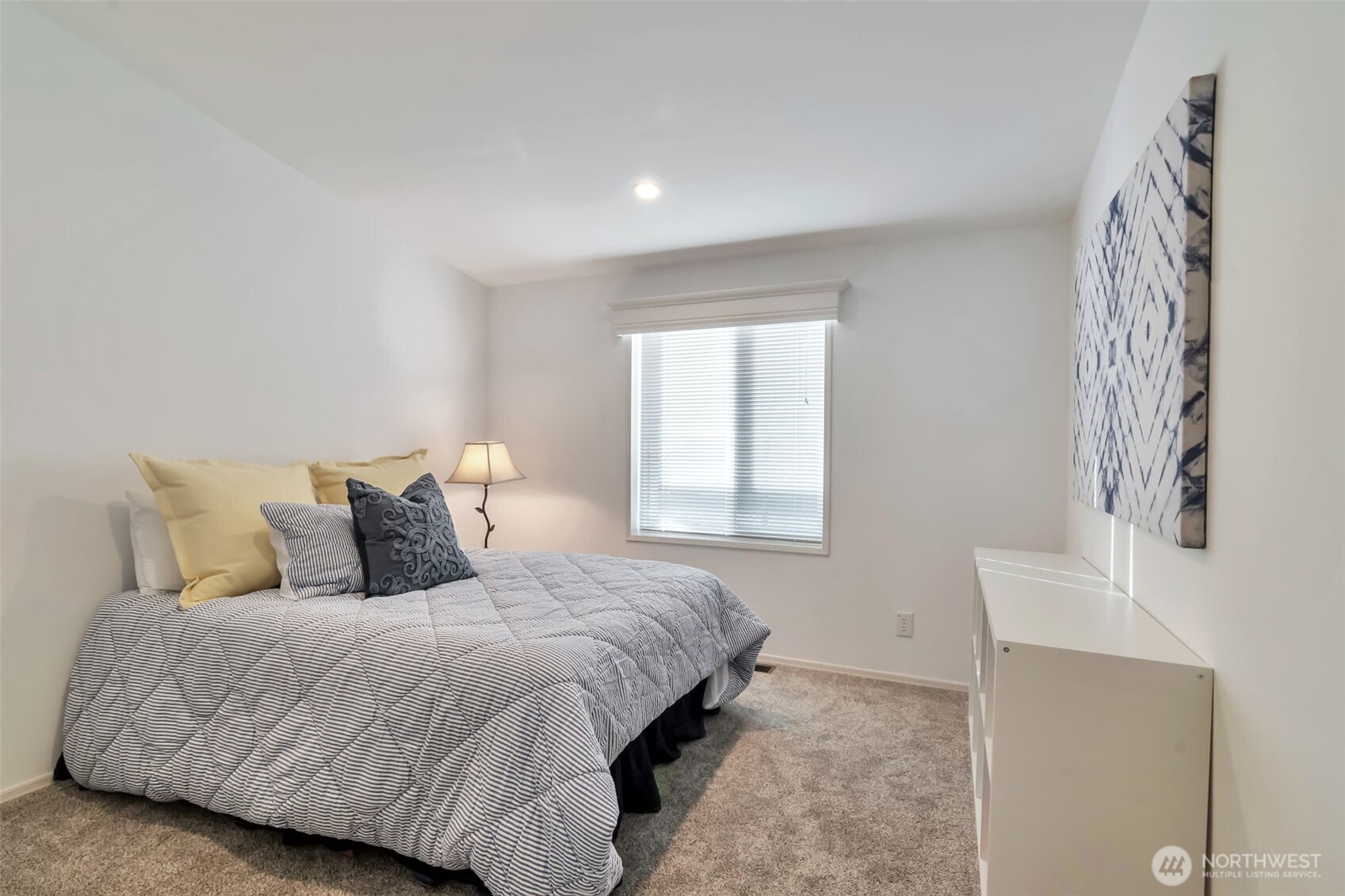 23708 Locust Way, Unit 65 Bothell, WA 98021 - Photo 22 of 32 a bedroom with a bed and a window