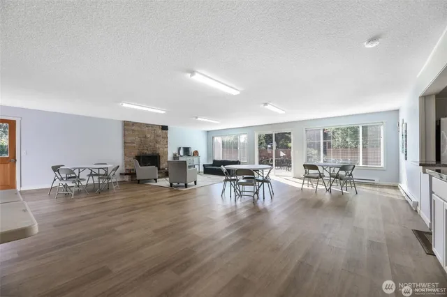 a view of dining room with furniture and wooden floor