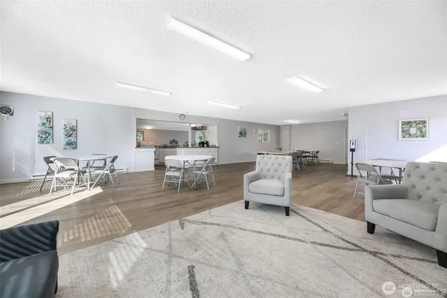 a living room with furniture and white walls