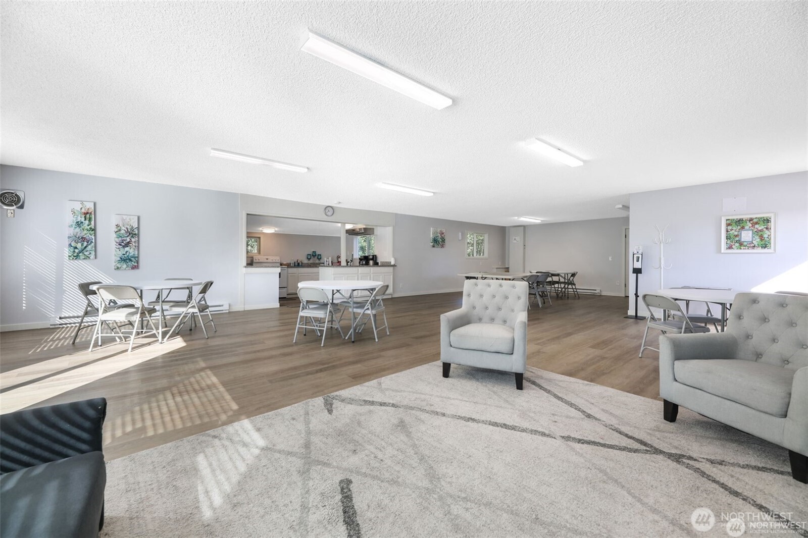 23708 Locust Way, Unit 65 Bothell, WA 98021 - Photo 30 of 32 a living room with furniture and white walls