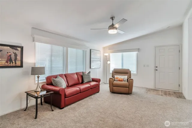 a living room with furniture and a window