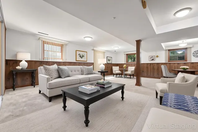 a living room with furniture and a lamp