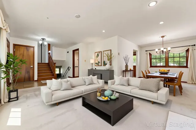 a living room with furniture and a table