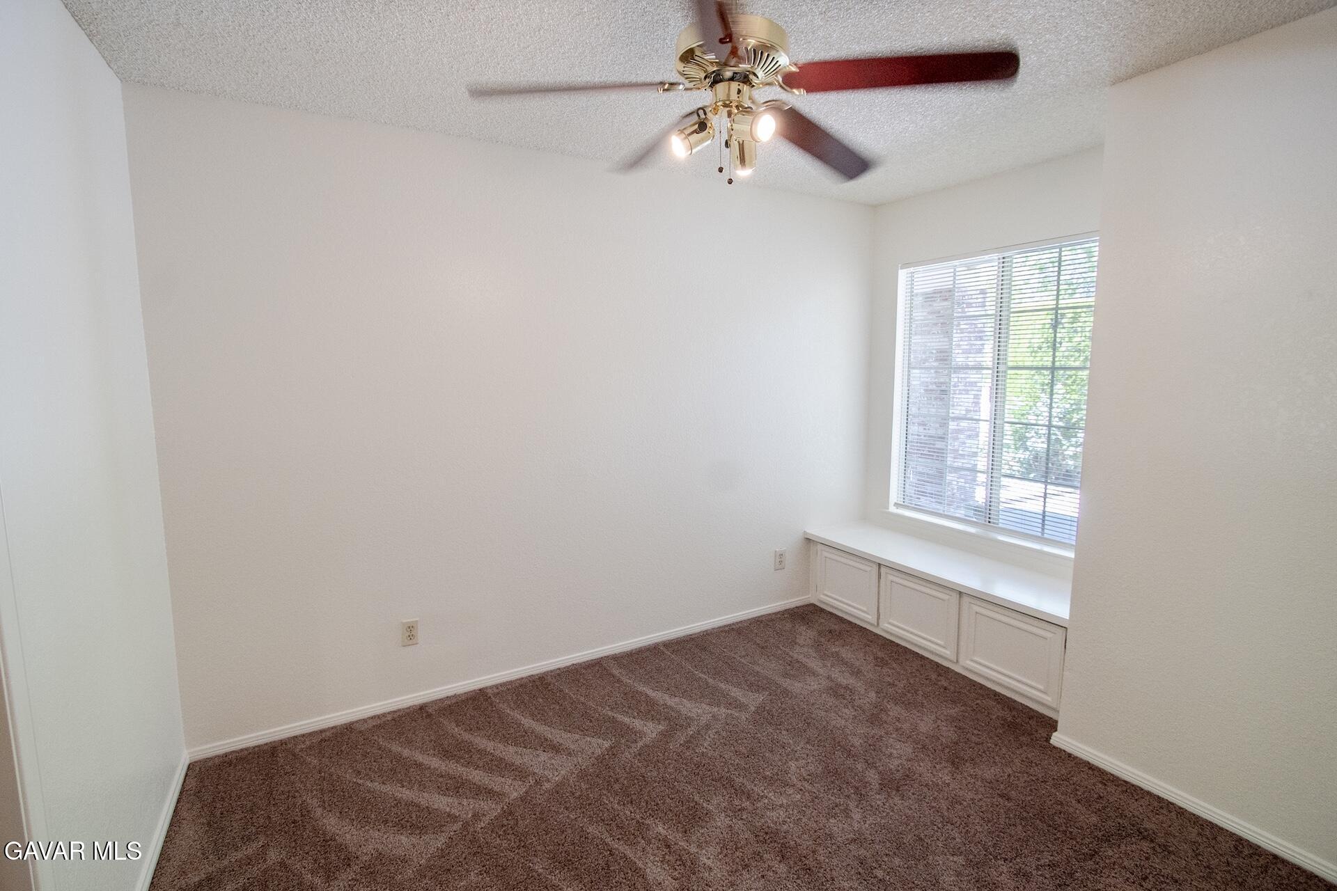 44318 33rd Street West Lancaster, CA 93536 - Photo 25 of 29 a view of room window and ceiling fan