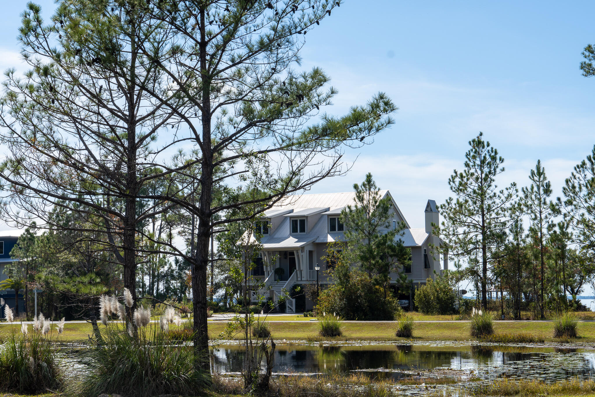 Lot 115 Oak Harbor Freeport, FL 32439 - Photo 8 of 17 a front view of a house with a yard