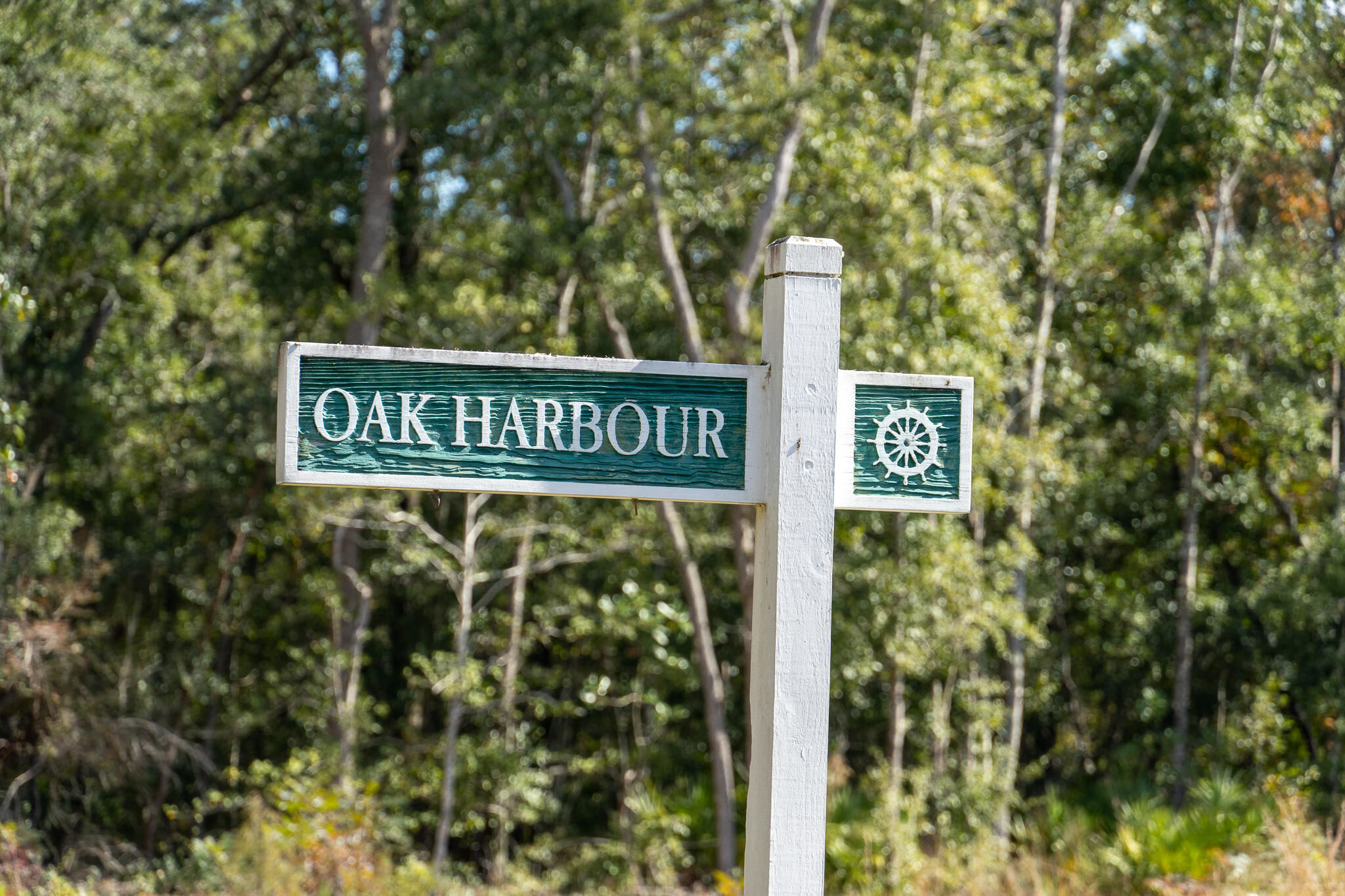 Lot 115 Oak Harbor Freeport, FL 32439 - Photo 9 of 17 a street sign sitting on a pole