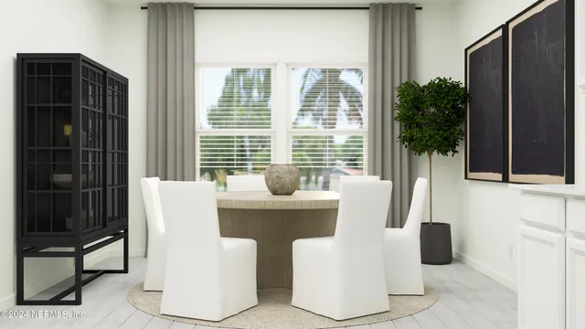 a bedroom with a bed and a potted plant