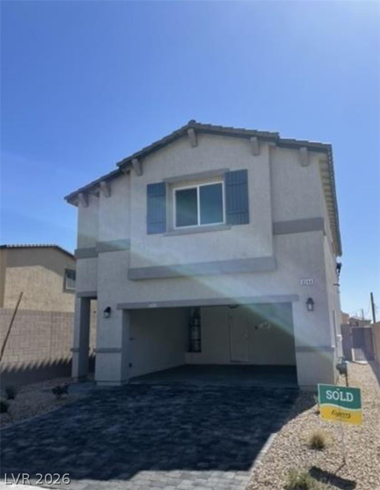 8244 Selenite Street Las Vegas, NV 89113 - Photo 1 of 16 This two-story residence features a charming exterior with a paved driveway and stucco construction.
