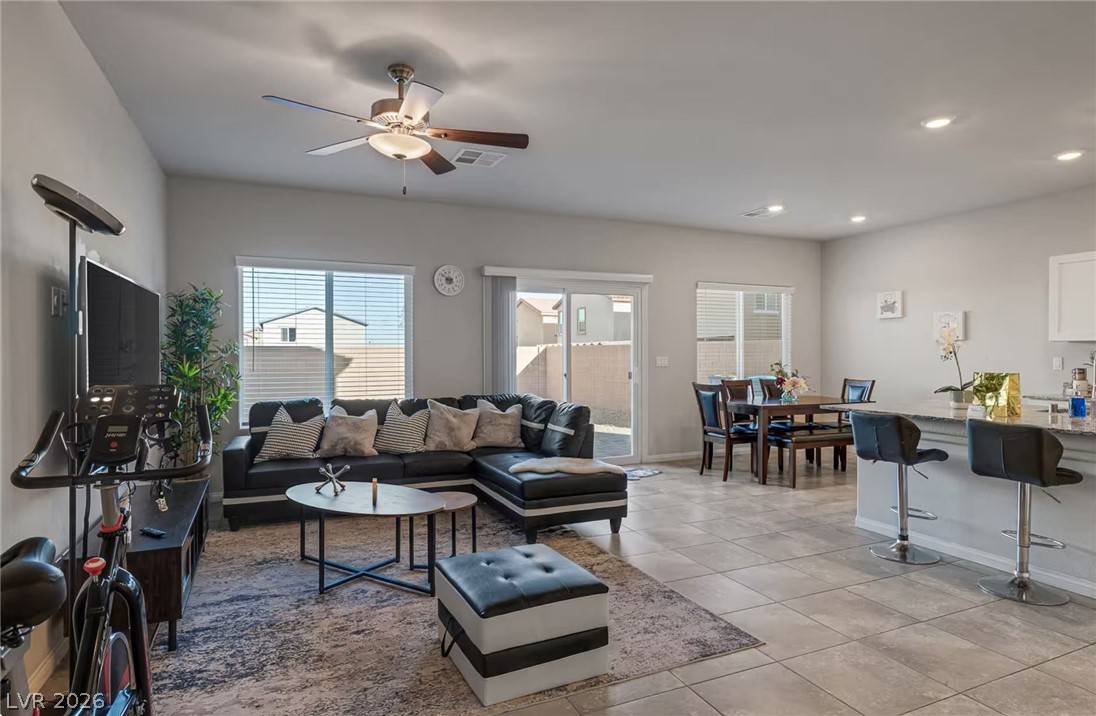 8244 Selenite Street Las Vegas, NV 89113 - Photo 2 of 16 An inviting open-concept living area with a bright and airy atmosphere.