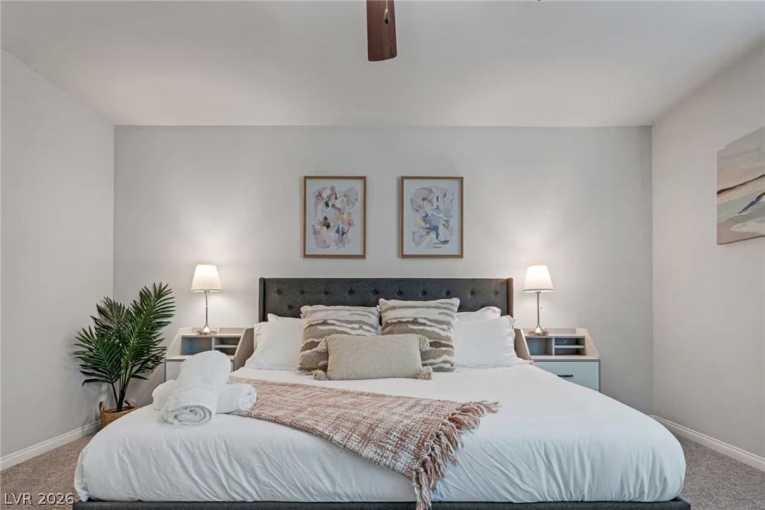 8244 Selenite Street Las Vegas, NV 89113 - Photo 8 of 16 This restful bedroom features soft tones, plush carpeting, and abundant natural light.