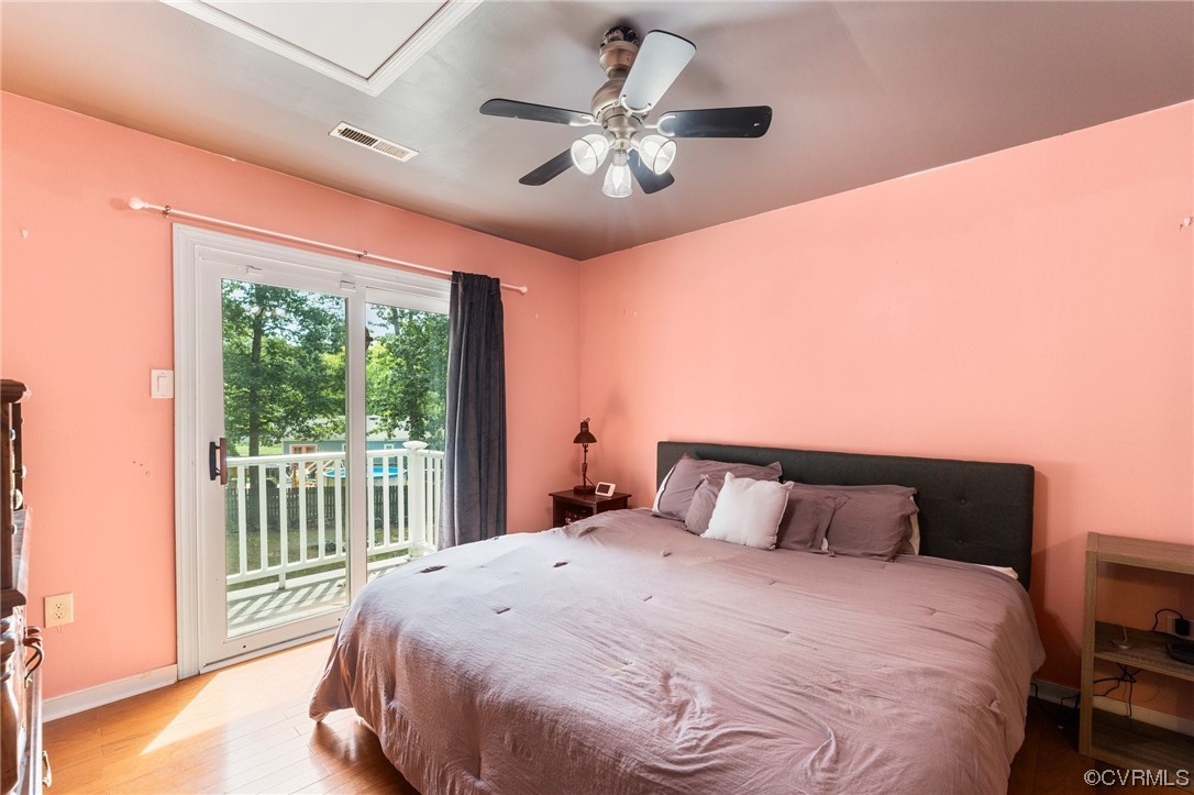 10706 Genlou Road Chesterfield, VA 23832 - Photo 28 of 34 a bedroom with a large bed and a large window
