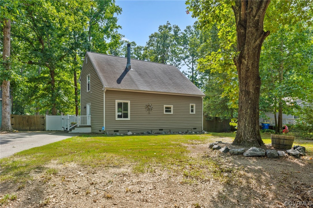 10706 Genlou Road Chesterfield, VA 23832 - Photo 3 of 34 a view of a house with a yard