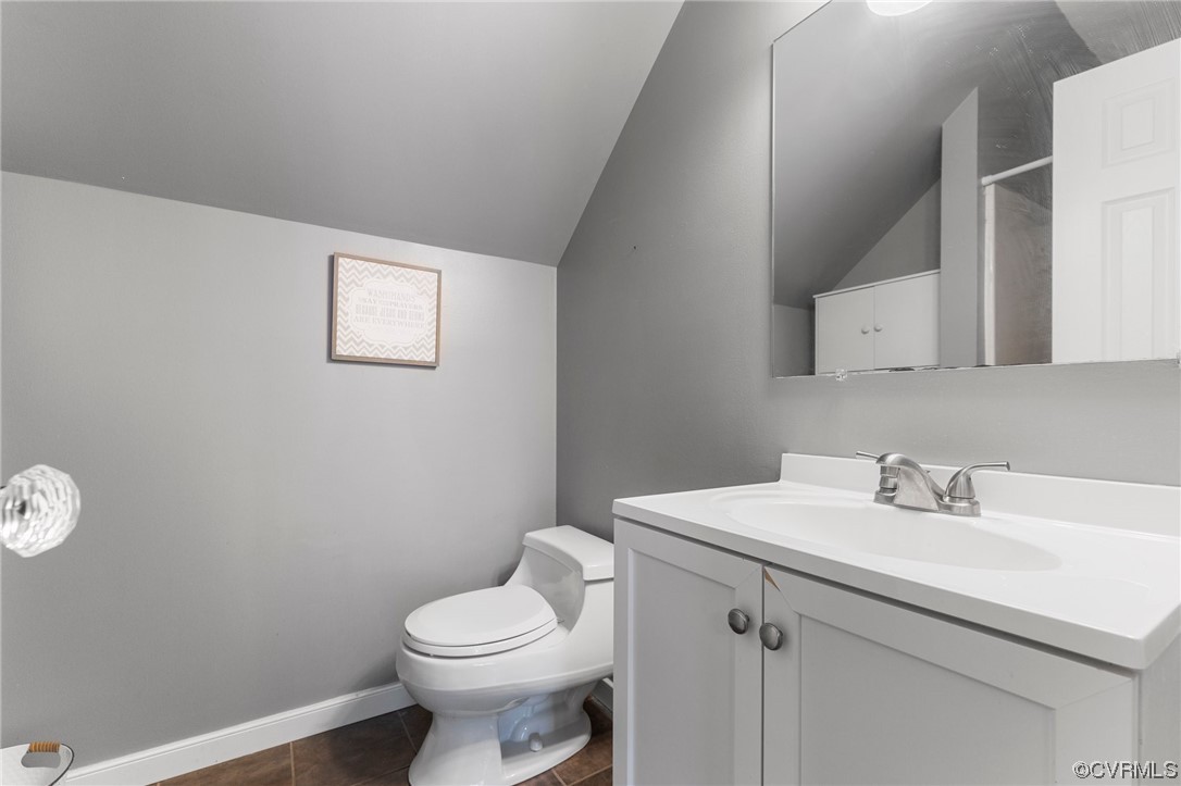 10706 Genlou Road Chesterfield, VA 23832 - Photo 31 of 34 a bathroom with a sink a toilet and mirror