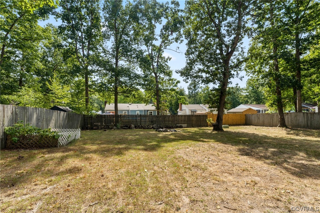 10706 Genlou Road Chesterfield, VA 23832 - Photo 33 of 34 a view of a yard with plants and trees