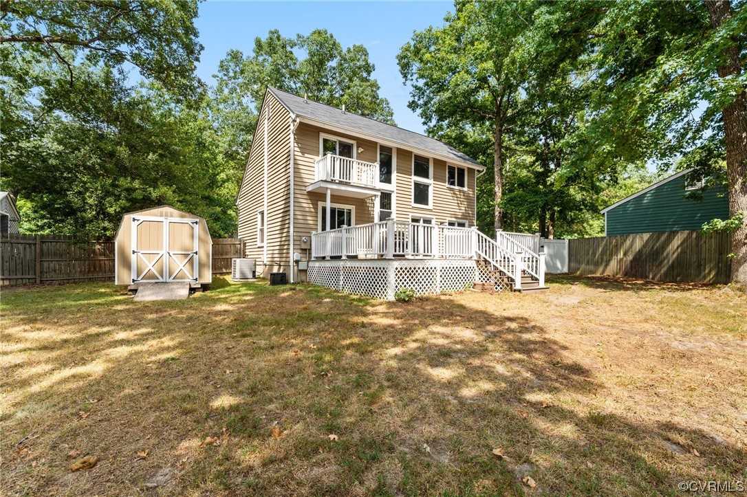 10706 Genlou Road Chesterfield, VA 23832 - Photo 34 of 34 a view of a house with a yard and large tree