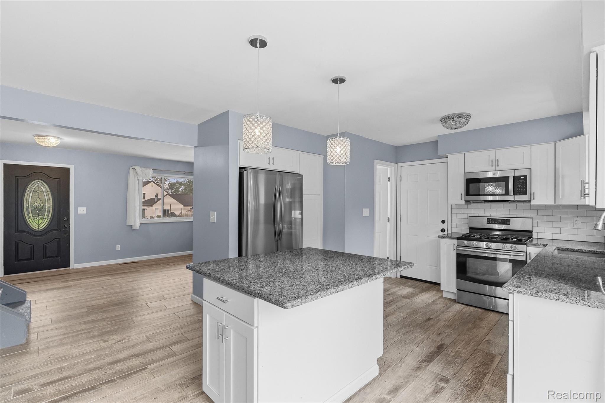 819 Alpine Trail Fenton, MI 48430 - Photo 10 of 41 Modern kitchen with white cabinetry and stainless steel appliances