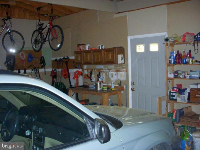 14945 Wellwood Road Silver Spring, MD 20905 - Photo 28 of 30 TWO CAR GARAGE, DOOR TO REAR YD, AUTO OPENERS