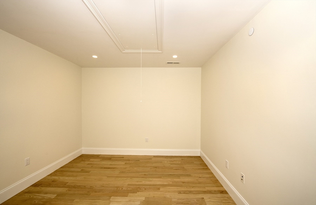 25 Clubview Drive, Unit 25 Andover, MA 01810 - Photo 11 of 19 a view of a room with wooden floor