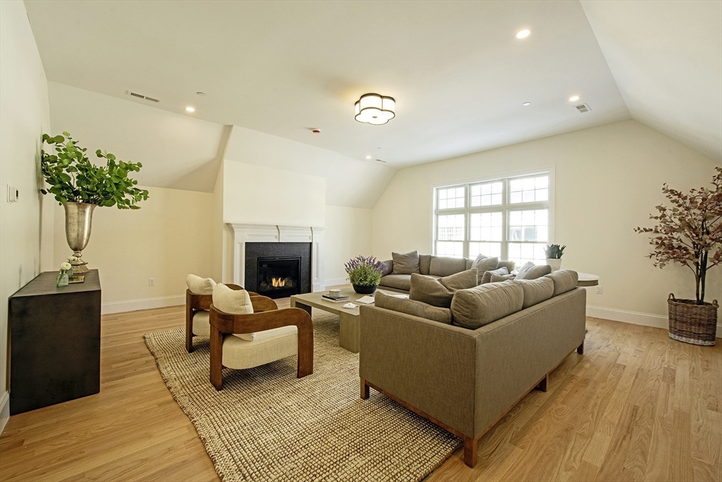 25 Clubview Drive, Unit 25 Andover, MA 01810 - Photo 13 of 19 a living room with furniture and a fireplace