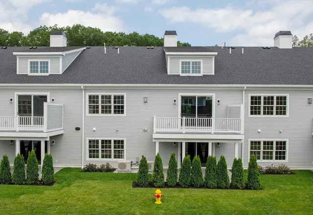 a front view of a house with garden and porch