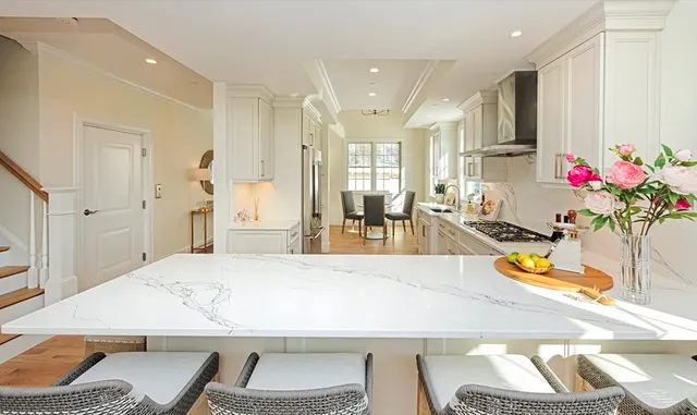 a living room with dining table and chairs