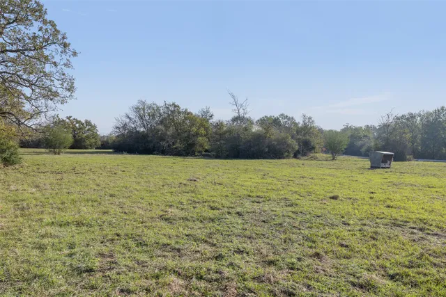 a view of a field with an outdoor space