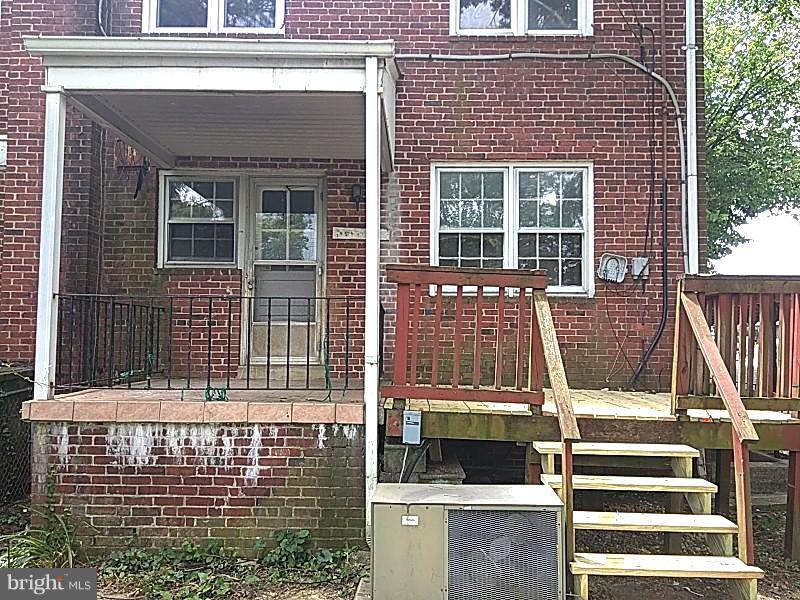 4028 Fallstaff Road Baltimore, MD 21215 - Photo 24 of 28 a view of front door of house with stairs
