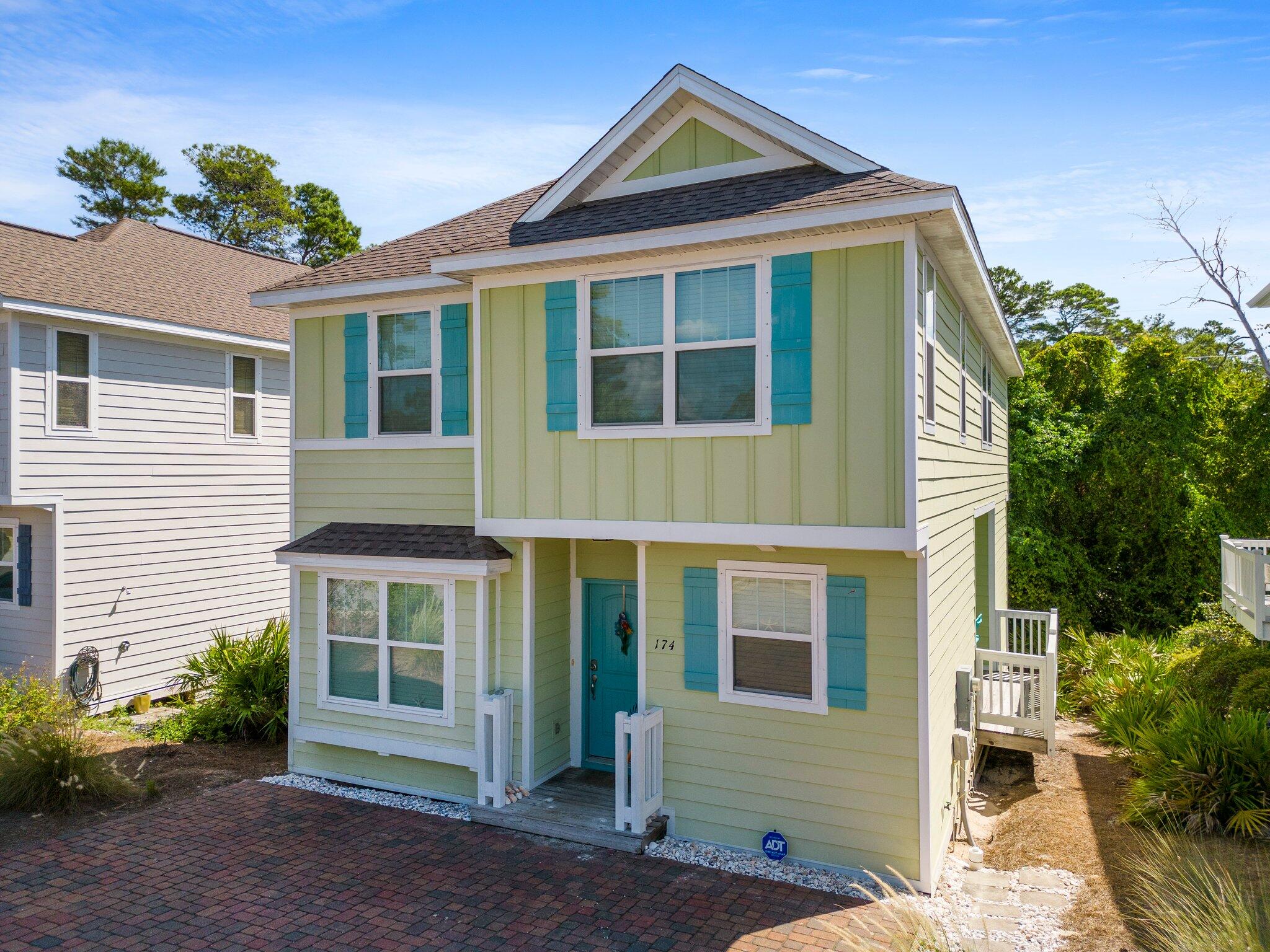 174 Sandpine Loop Inlet Beach, FL 32461 - Photo 1 of 45 a front view of a house with a yard