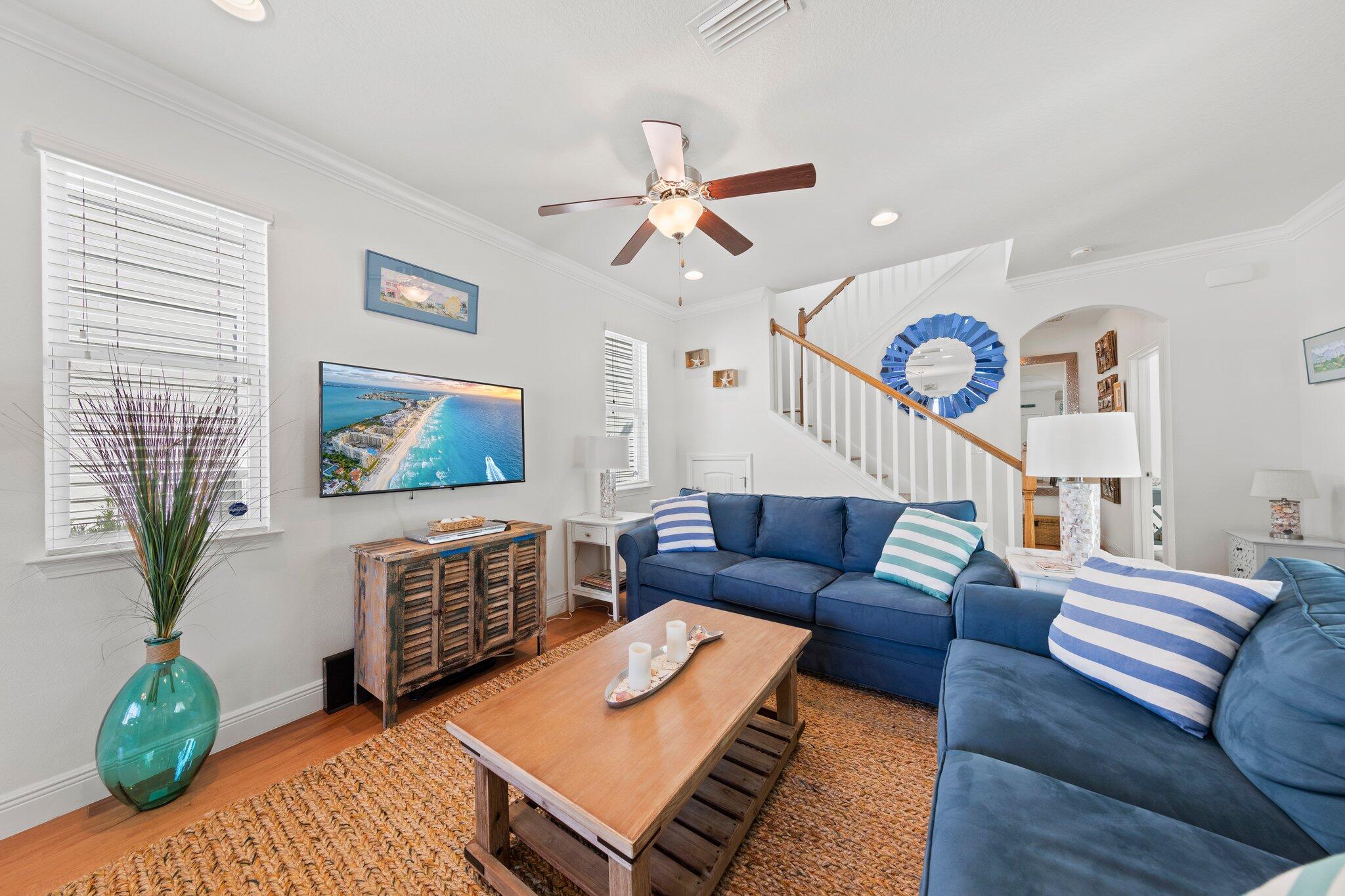 174 Sandpine Loop Inlet Beach, FL 32461 - Photo 20 of 45 a living room with furniture a chandelier and a rug