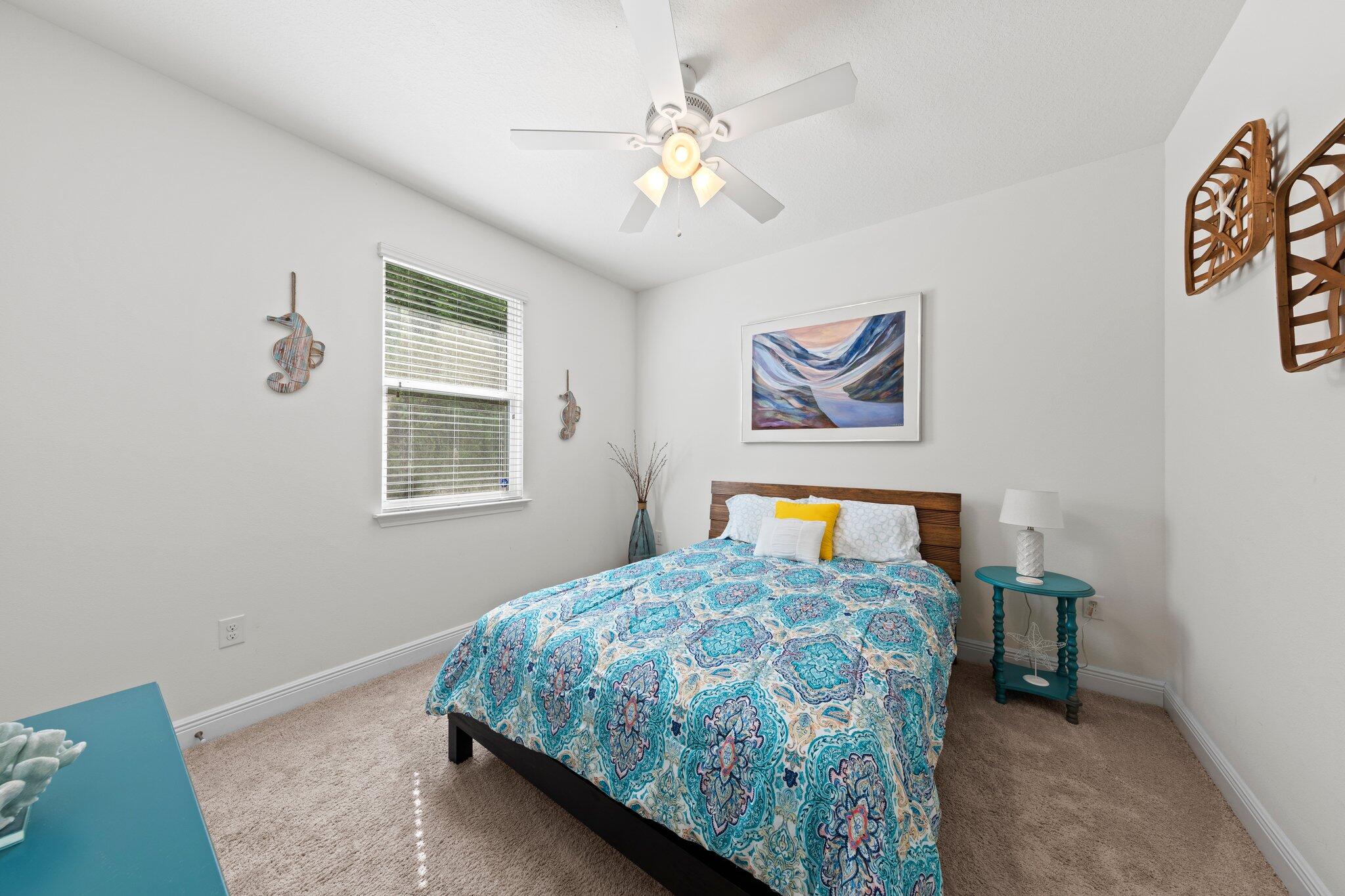 174 Sandpine Loop Inlet Beach, FL 32461 - Photo 27 of 45 a bedroom with a bed and a chandelier