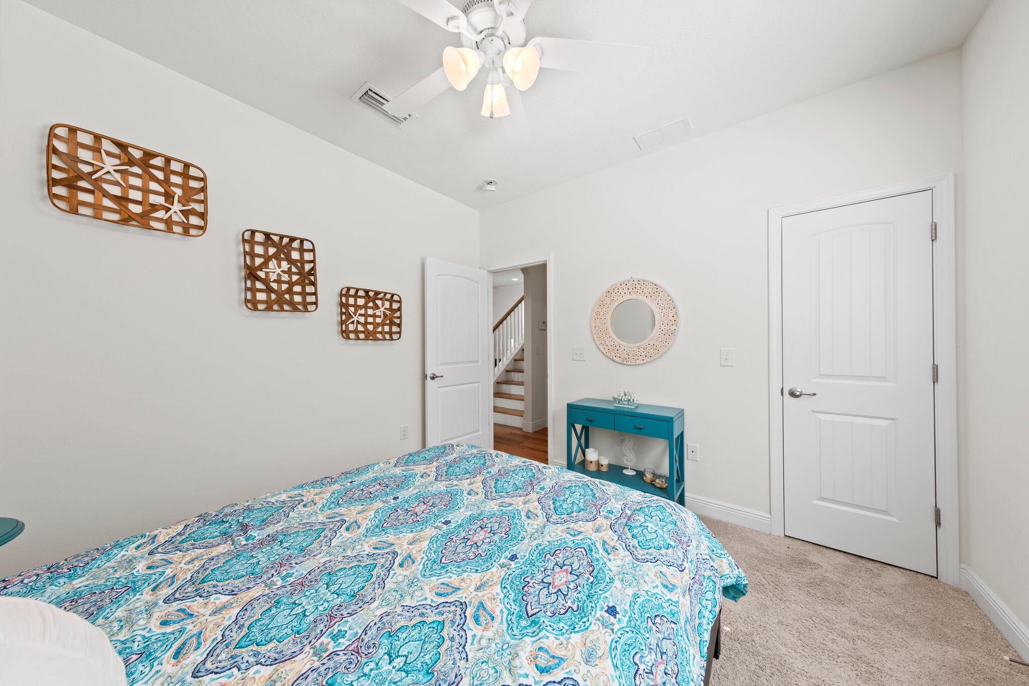 174 Sandpine Loop Inlet Beach, FL 32461 - Photo 28 of 45 a bedroom with a bed and a chandelier