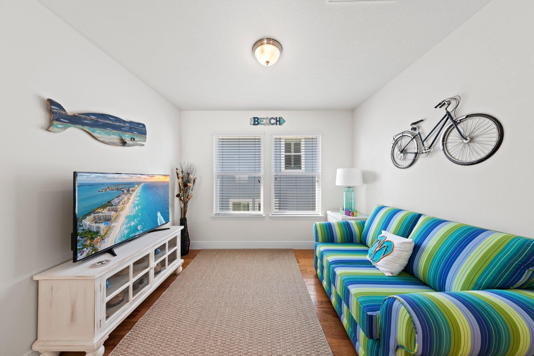 174 Sandpine Loop Inlet Beach, FL 32461 - Photo 33 of 45 a living room with furniture and a flat screen tv