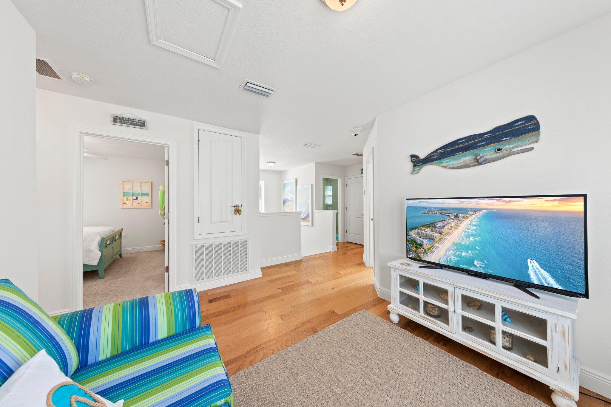 174 Sandpine Loop Inlet Beach, FL 32461 - Photo 34 of 45 a living room with a flat screen tv and a table