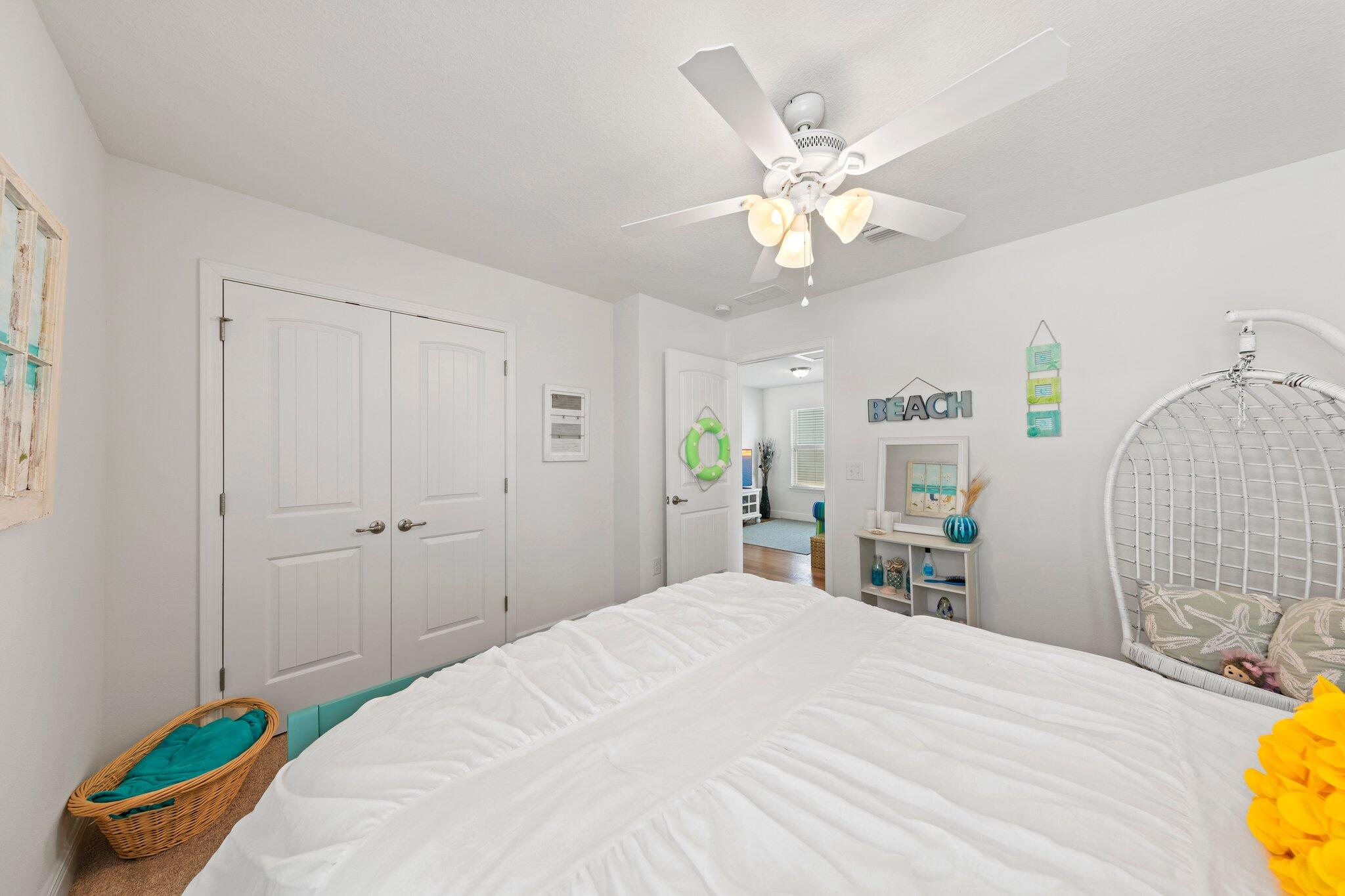 174 Sandpine Loop Inlet Beach, FL 32461 - Photo 36 of 45 a bedroom with a bed and a chandelier