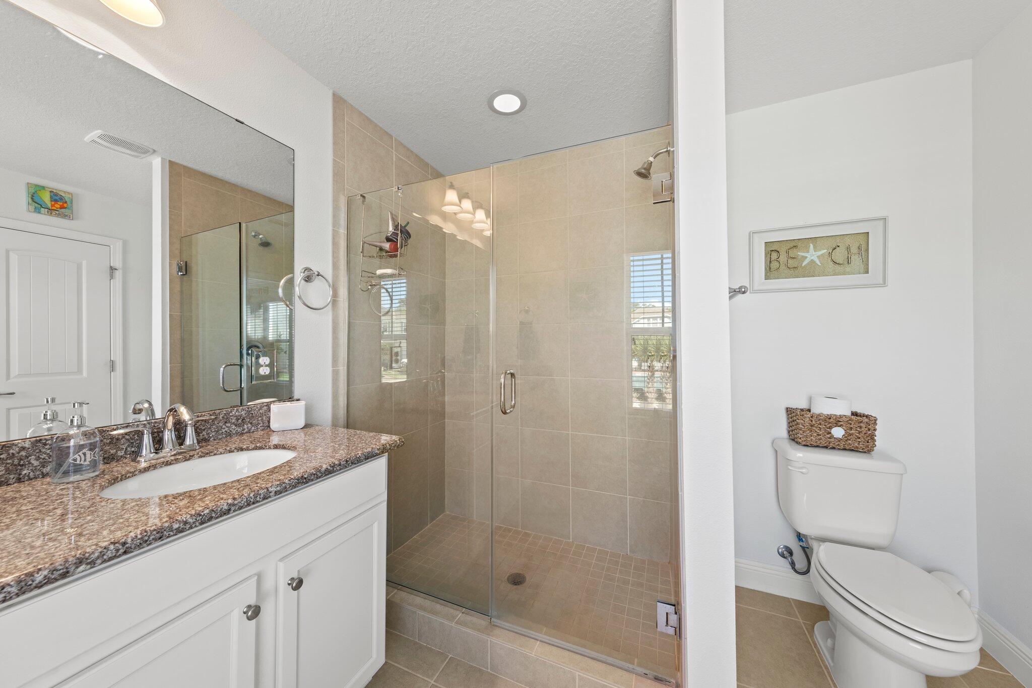 174 Sandpine Loop Inlet Beach, FL 32461 - Photo 43 of 45 a bathroom with a granite countertop sink toilet and shower