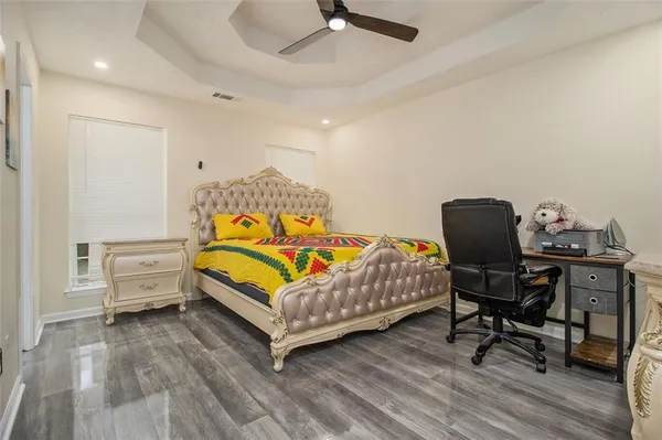 a bedroom with a bed and a chair
