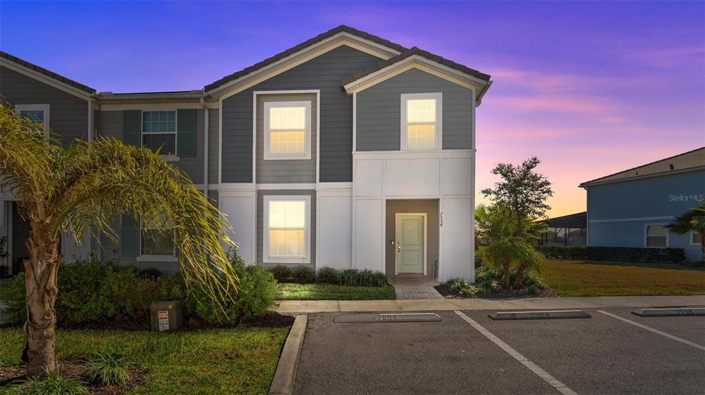 7554 Oak Spring Lane Davenport, FL 33837 - Photo 2 of 74 a front view of a house with a yard
