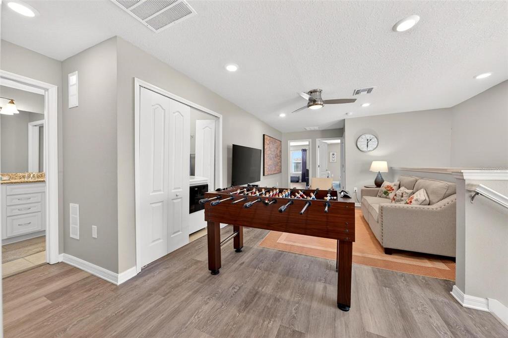 7554 Oak Spring Lane Davenport, FL 33837 - Photo 29 of 74 a living room with furniture and a wooden floor