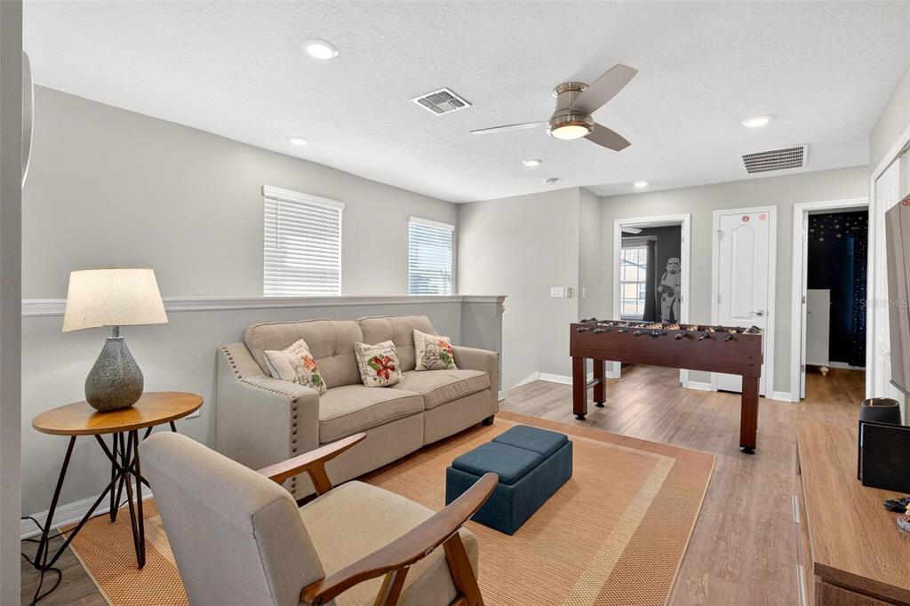 7554 Oak Spring Lane Davenport, FL 33837 - Photo 31 of 74 a living room with furniture and a rug