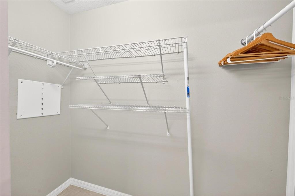7554 Oak Spring Lane Davenport, FL 33837 - Photo 41 of 74 a view of a room with racks on the wall
